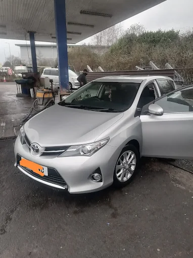 Mr. Shine signage on a Toyota